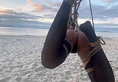 Beautiful Lari in shibari bondage at sunset, exposing her small tits and pussy