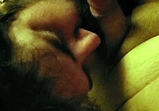 The hungry boy searches for food in the kitchen, hoping to find something satisfying.