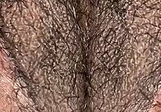 Juicy phat chocolate pussy glistens with wetness in detailed close-up