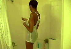 Sweetcandi4u teases her wet panties on webcam, revealing her ebony ass in a ghetto setting with sensual touches
