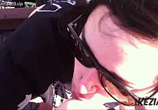 Latina brunette blows on tall bridge.