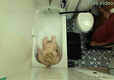 annie archer in the shower with hanging bag