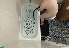 annie archer in the shower with hanging bag