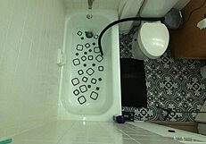 annie archer in the shower with hanging bag