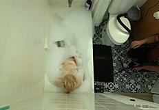 annie archer in the shower with hanging bag