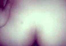 The couple enjoys anal doggystyle, bent over, leading to orgasm in her ass.