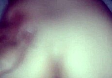 The couple enjoys anal doggystyle, bent over, leading to orgasm in her ass.