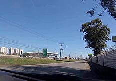 she's naked in front of the gremio arena, showing off her big tits for voyeur eyes