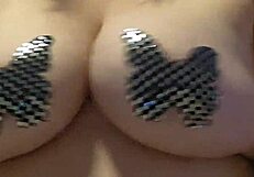 In this casual story, she teases her big natural tits while masturbating