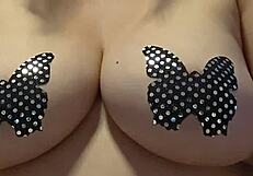 In this casual story, she teases her big natural tits while masturbating