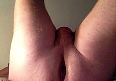 she stretches her ass with a huge dildo, fucking it deep