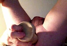 she stretches her ass with a huge dildo, fucking it deep