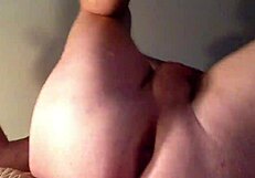 she stretches her ass with a huge dildo, fucking it deep