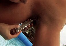 we're in the pool fucking with a glass dildo, but my tongue's getting tired