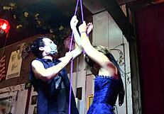 Nyx endures tickling in corset bondage