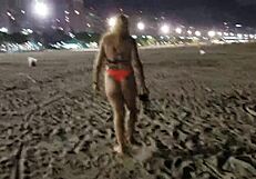 Look at this blonde showing her tits and pussy on the beach!