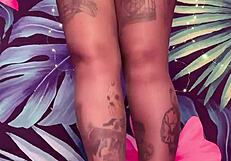 teasing in ripped pantyhose and latex dress