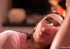 Brunette babe gives blowjob and handjob by the fireside, ending with cumshot.