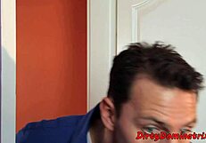 pretty dominatrix having fun with a cucumber in bondage