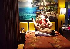 Peruvian girl in red corset poses with her amateur couple at home