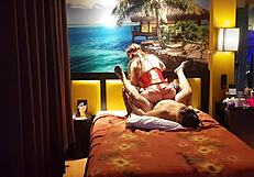 Peruvian girl in red corset poses with her amateur couple at home