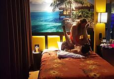 Peruvian girl in red corset poses with her amateur couple at home