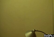 beautiful petite brunette teases camera in bedroom