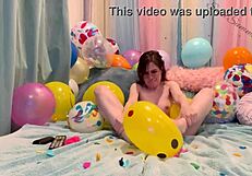 Loner girl pops balloons with her small tits