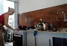 stella posing naked in the bedroom and kitchen in red