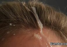 kinky bombshell sucking cum off her face