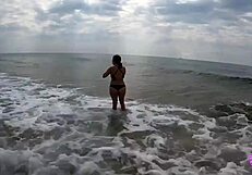 This hot couple couldn't resist banging on a public beach.