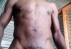 She kneels to masturbate a monster black cock with big balls