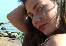 Cristelle reaches orgasm on the beach with dirty fingers in her tight pussy