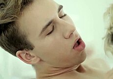 Cute Twinks Engage in Intense Bareback Action on Cozy Bed