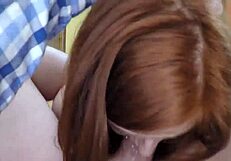 adorable redhead passionately sucks cock