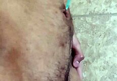 Gay man playing with his navel