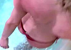 shemale teases tits, wanks shecock in jacuzzi