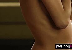 Petite babe Justine Miller strips and shows shaved pussy with small natural tits.