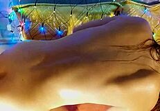 sexy babe rides dildo in close-up anal and vaginal play, reaching multi orgasms under romantic lights