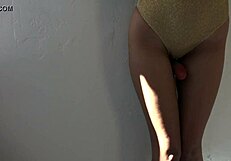 Gold leotard worn by older woman with toys