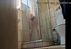 Oh wow, I caught my stepmom fucking her pussy with a glass dildo in the shower!