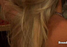 Bound lesbian slave orgasms under mistress's domination with collar and leash.