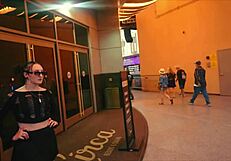 A white woman being lured by an older man through the casino in Las Vegas