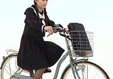 Japanese Girl in Uniform on Bicycle