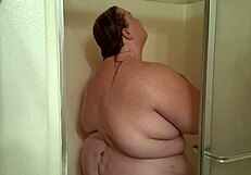 Kitania K Wildfire Showers, Revealing Her Big Tits and Ass Under the Water.