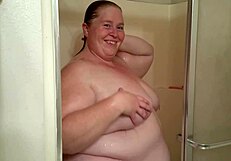 Kitania K Wildfire Showers, Revealing Her Big Tits and Ass Under the Water.