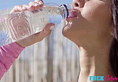 Katrin Tequila bends over by the pool, inviting questions about her outdoor adventures