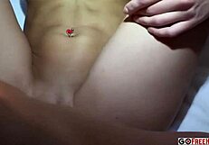 young petite woman enjoys a relaxing session in bed