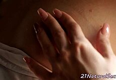 A classy European babe masturbates her wet pussy alone