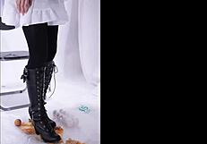 The boot crushes food in a fetish scene, leaving messy remains on the floor.